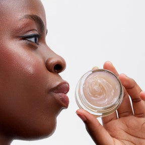 image mood model holding the glossy lip line eraser lip balm in her hands with content showing clearly